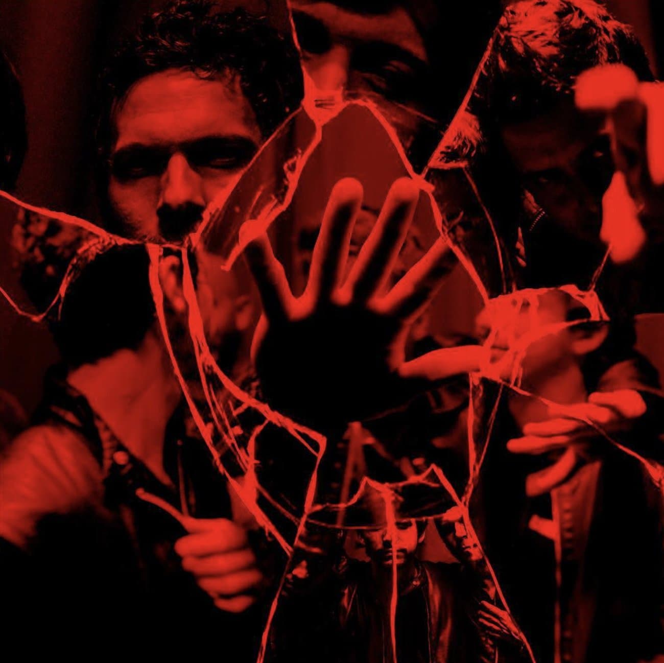 A hand pressed against shattered glass, fragmented reflections in red
