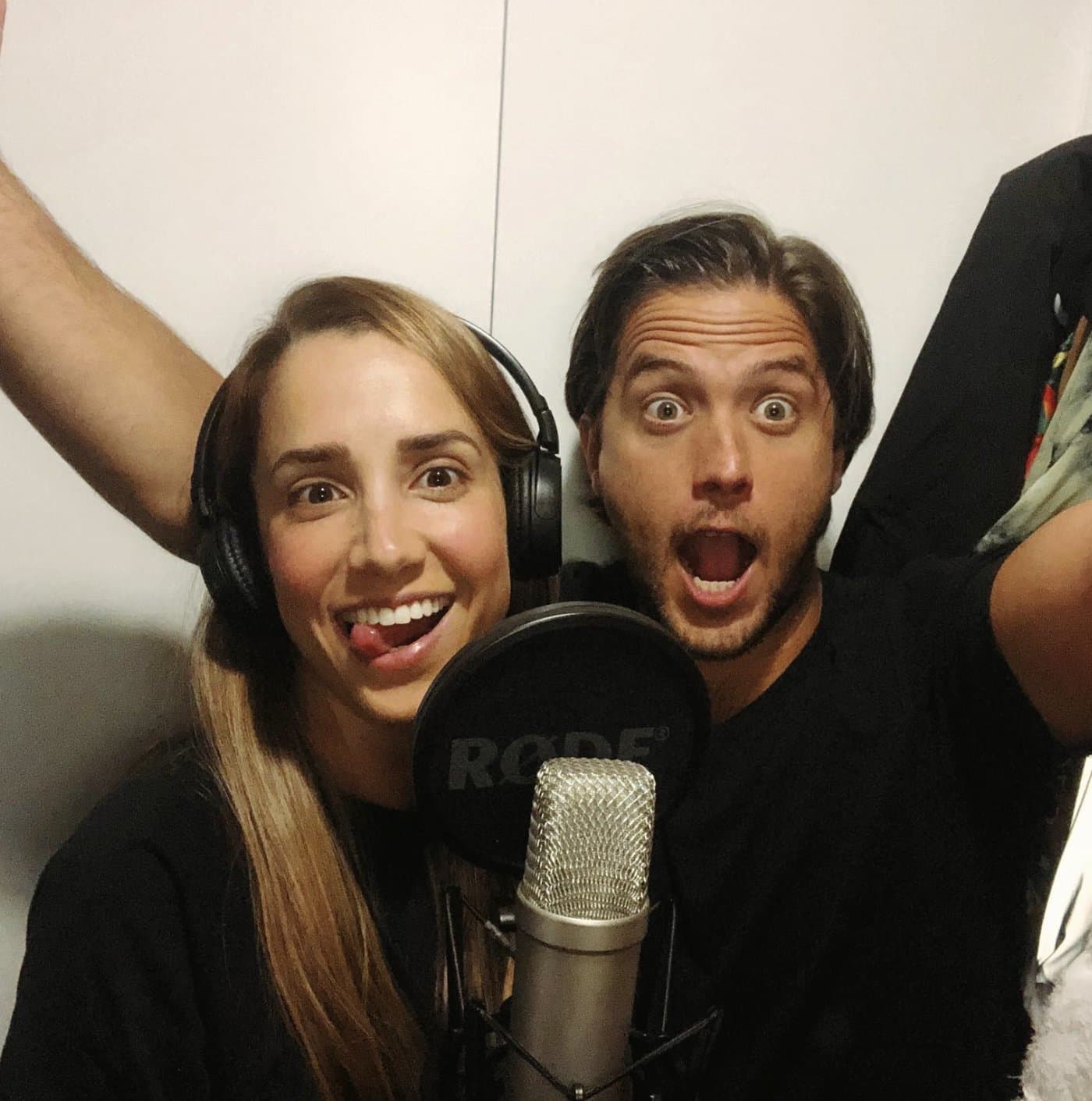 Marcia and Rodrigo recording OTA songs at the microphone